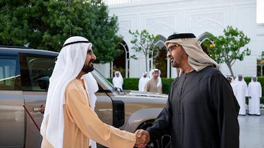 President Sheikh Mohamed greets Sheikh Mohammed bin Rashid, Vice President, Prime Minister and Ruler of Dubai, at Qasr al Bahr. Photo: UAE Presidential Court ---