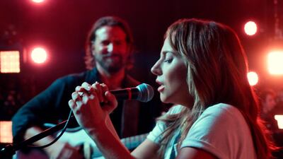 Bradley Cooper, left, and Lady Gaga in a scene from the latest reboot of the film, A Star is Born. AP