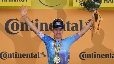 Israel Premier Tech's Simon Clarke celebrates on the podium. AP