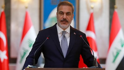 Hakan Fidan speaks during his visit to Baghdad. AFP