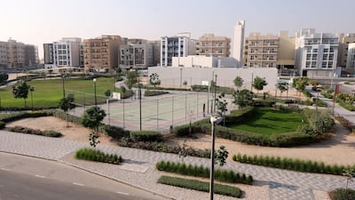 The apartment overlooks a park with a running track and basketball court