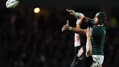 Tom Donnelly of the All Blacks competes with Victor Matfield during their Tri Nations match last weekend.
