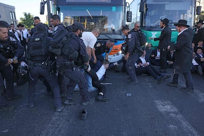 Israeli police disperse ultra-Orthodox Jews protesting against conscription by blocking the entrance to Jerusalem. AFP