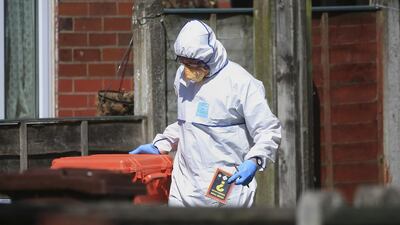 Police forensic investigators search the Greater Manchester home of suicide bomber Salman Abedi on May 23, 2017. Danny Lawson / PA via AP