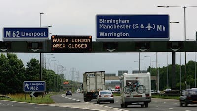 A sign on the southbound carriageway of the M6 motorway advises drivers to avoid London following the explosions