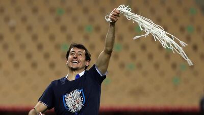 Real Sociedad's winger Mikel Oyarzabal cuts the goal net after winning the 2020 Copa del Rey. EPA