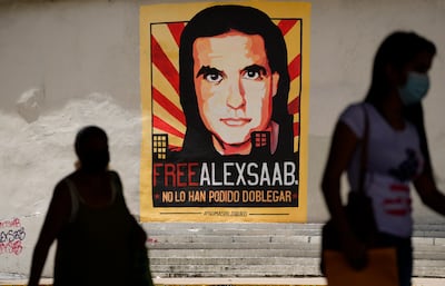 A poster calling for the release for Alex Saab on display in Caracas. AP