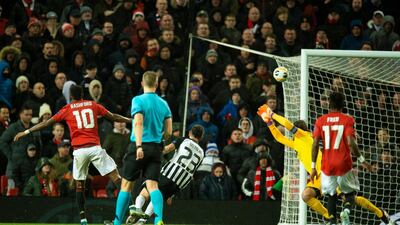 Marcus Rashford scores United's third. EPA