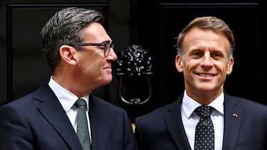 Britain's Prime Minister Andy Burnham (L) and France's President Emmanuel Macron meet ahead of a bilateral meeting at 10 Downing Street. AFP
