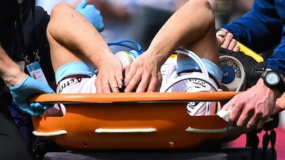 Burnley midfielder Ashley Westwood is carried off on a stretcher after being injured in the 1-1 draw against West Ham. AFP