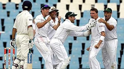 Chargers’ Dale Steyn, left, celebrates the dismissal of Zaheer Khan in Hyderabad.