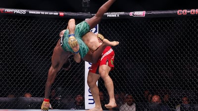 Leon Edwards and Belal Muhammad grapple. PA