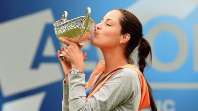 Ana Ivanovic holds up the trophyfor her victory at the WTA Birmingham Open on Sunday. Tom Dulat / Getty Images / June 15, 2014