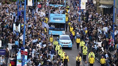 Manchester City players on the open-top bus during the Premier League trophy parade. PA