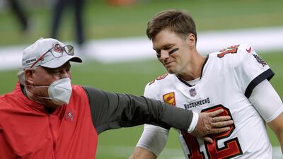 Tampa Bay Buccaneers coach Bruce Arians, left, speaks with quarterback Tom Brady before the team's NFL divisional round playoff football game against the New Orleans Saints on January 17. AP