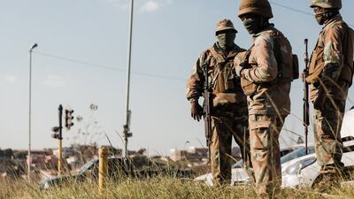 A member of the South African National Defence Force (SANDF) deployed outside the Phoenix Police Station in Phoenix township, north of Durban.