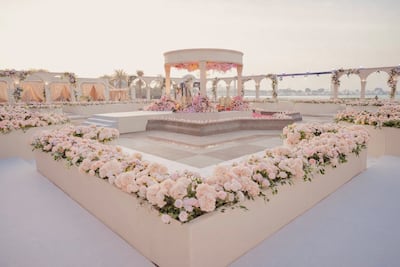 Seating at the Emirates Palace wedding was arranged to echo the formal geometry of a chateau, while dinner became a relaxed garden picnic. Photo: Envelop