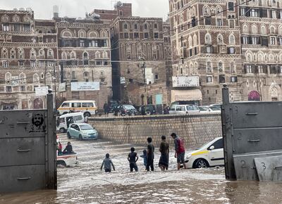 Boys play on a flood road in the old quarter of Sanaa, Yemen, on Monday. Reuters
