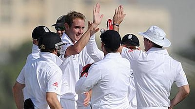 Stuart Broad celebrates dismissing Kyle Coetzer in the tour match in Dubai.