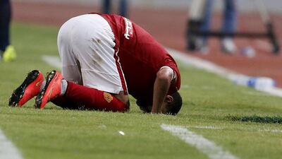 Moamen Zakaria of Al Ahly celebrates in prayer after scoring his second goal against Zamalek in a 2-0 Egyptian Premier League on Tuesday in the Cairo derby, played in Alexandria without spectators because of security concerns. Amr Abdallah Dalsh / Reuters