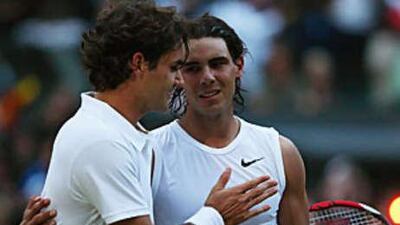 Roger Federer, left, congratulates Rafael Nadal after the Spaniard had ended Federer's dominance at Wimbledon.