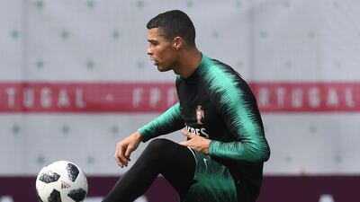 Cristiano Ronaldo controls the ball during a training session at their base camp in Kratovo, Moscow, Russia, on June 12, 2018. Francisco Leong / AFP