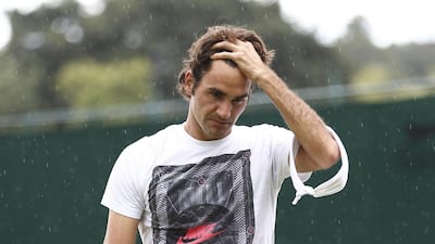 Roger Federer is pictured during a training session on at the All England Club as it rains in London on Saturday ahead of the 2014 Wimbledon men's singles final on Sunday. Andrew Cowie / AFP
