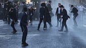 Israeli police use a water cannon to disperse ultra-Orthodox Jews protesting against conscription by blocking the entrance to Jerusalem, near the Chords Bridge. AFP