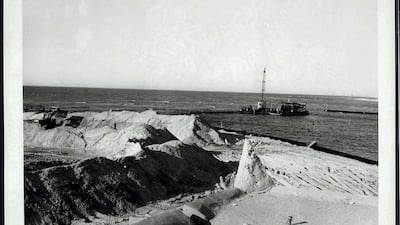A dredger at work close to the mouth of Dubai Creek in April, 1960. Courtesy Arabian Gulf Digital Archive