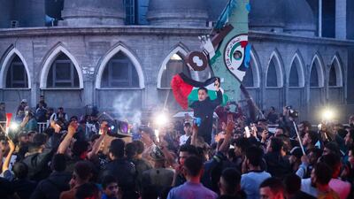 Palestinians celebrate in a street in Rafah, in the southern Gaza Strip, after Hamas announced it accepted the truce proposal on May 6. AFP