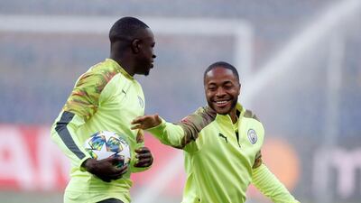 Manchester City City's Raheem Sterling, right, and Benjamin Mendy. AP