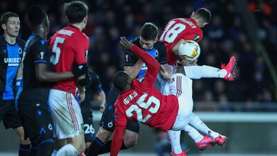 Manchester United's Odion Ighalo, front, fights for a ball with Brugge's Brandon Mechele during their Europa League round of 32 first leg at the Jan Breydel Stadium. AP