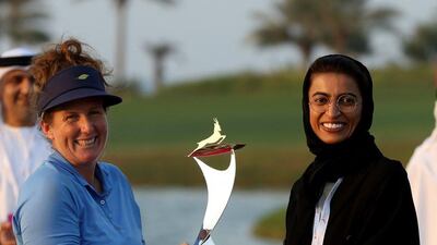 Beth Allen and Noura Al Kaabi, Minister of State for FNC Affairs, with the Fatima bint Mubarak Ladies Open trophy on Saturday. Photo Courtesy / Getty Images / FBM Ladies Open / November 5, 2016
