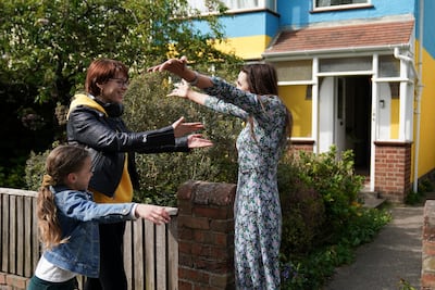 Rend Platings, right, and her daughter Samantha welcome Kristina Korniiuk to their home in Cambridge. PA