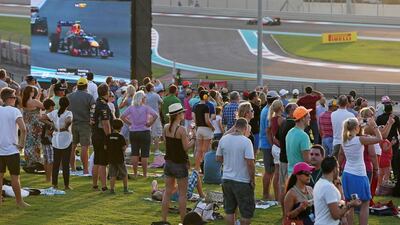 People watching the Formula 1 Etihad Airways Abu Dhabi Grand Prix from Abu Dhabi Hill at Yas Marina Circuit. Pawan Singh / The National