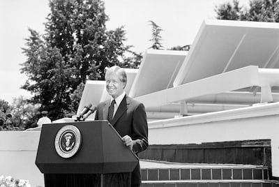 US President Jimmy Carter speaking in front of solar panels on the West Wing roof of the White House, announcing his solar energy policy in 1979. Getty
