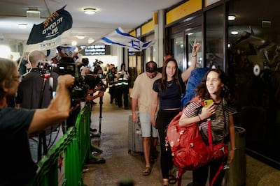 Passengers from the diverted flydubai flight are greeted at Ben Gurion Airport in Tel Aviv after arriving from Saudi Arabia on a retrieval flight. Getty Images