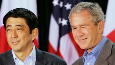 Japanese Prime Minister Shinzo Abe, left, and President George W Bush, right, attend a joint news conference at Camp David in 2006. AP Photo