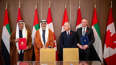 Sheikh Khaled and Mr Carney with Mohammed Al Mazrouei, Minister of State for Defence Affairs, and David McGuinty, Canada's Minister of National Defence
