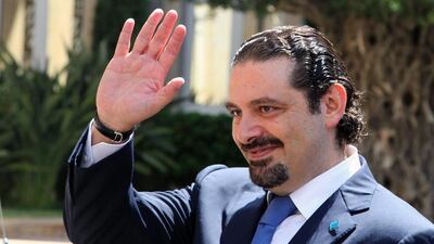 Former Lebanese prime minister Saad Hariri waves upon his arrival at the government house in Beirut on Aug 8, 2014. Dalati Nohra / AP Photo