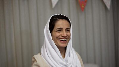 Iranian lawyer Nasrin Sotoudeh smiles at her house in Tehran on September 18, 2013, after being freed following three years in prison. AFP