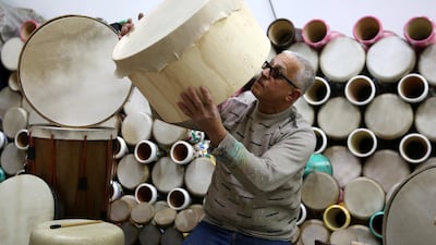 A Palestinian man makes drums in the Israeli occupied West Bank town of Hebron. Beating a drum to call on people to wake up for some last-minute eating before the start of the daily fast is a tradition followed in many parts of the world. EPA