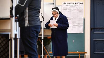 A nun casts her vote at Nano Nagle Hall in Irelands national election in Cork, Ireland. Getty Images