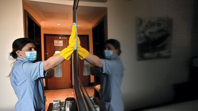 Staff members prepare the St Giles Hotel near Heathrow Airport for quarantining travellers. AFP