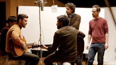 From left, Justin Timberlake, Oscar Isaac and the film-makers Joel and Ethan Coen during the filming of Inside Llewyn Davis. Courtesy Studio Canal