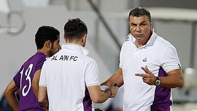 Al Ain have been transformed over pre-season by their new coach, Cosmin Olaroiu, right, who is looking to add a foreign striker to their ranks before the UAE football season starts.