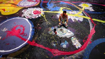 Artist Sacha Jafri works on the painting in September 2020 in Dubai. Getty Images