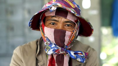 A farmer waits to be paid for his harvest at a rice mill in Khon Kaen, Thailand. Jorge Silva / Reuters