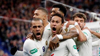 Dani Alves celebrates scoring Paris Saint-Germain's first goal with Neymar and other teammates in the French Cup final against Rennes. Charles Platiau / Reuters