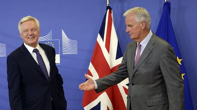 British secretary of state for exiting the European Union David Davis (L) is welcomed by the European Union's chief Brexit negotiator, Michel Barnier, prior to their meeting at the European Union Commission headquarters in Brussels on July 17, 2017. Thierry Charlier / AFP
